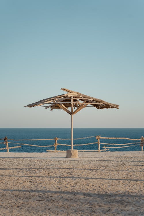 Broken Beach Umbrella on Shore