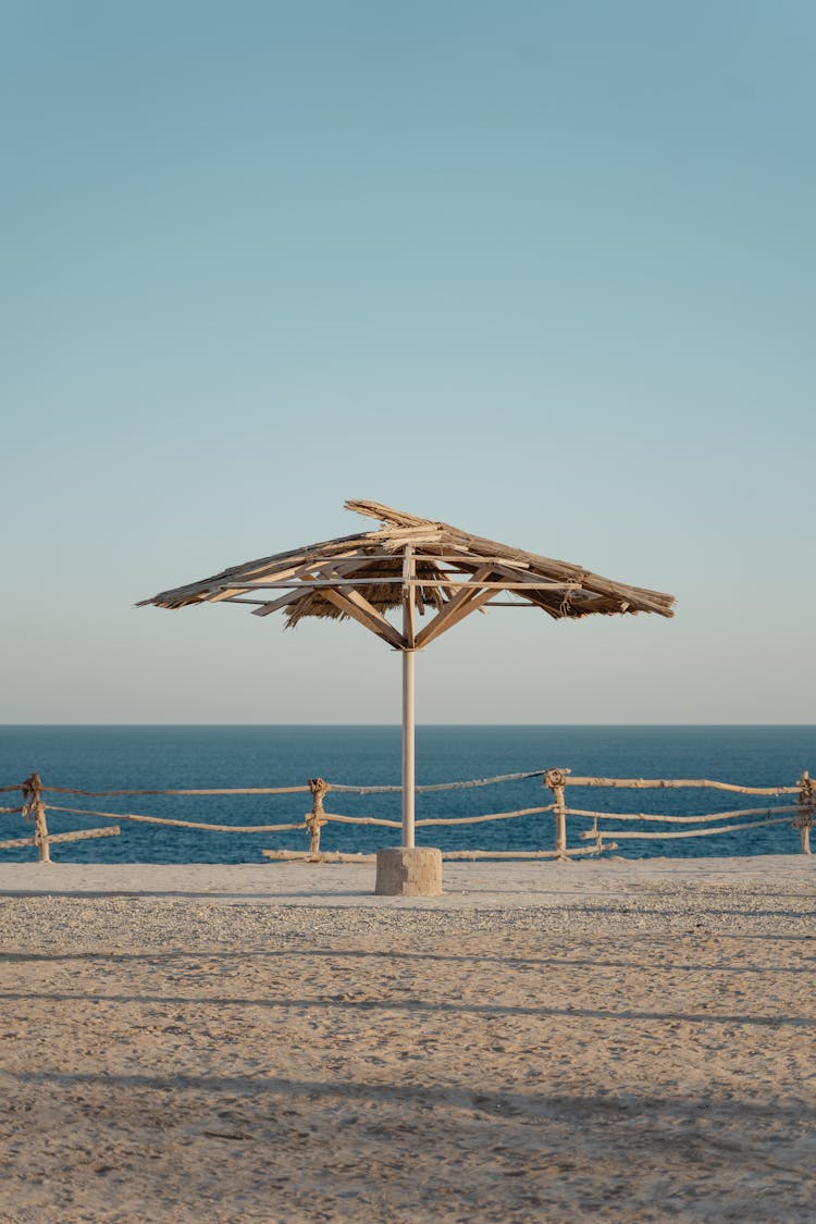 Broken Beach Umbrella On Shore