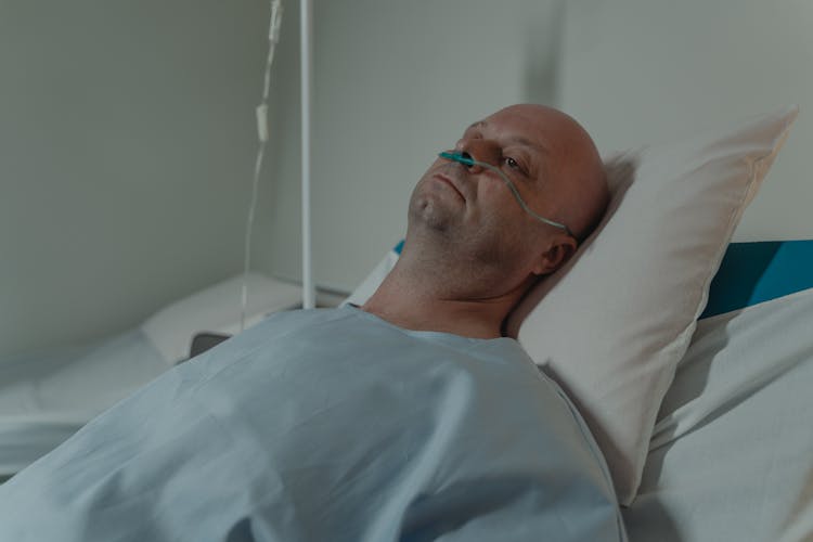 Patient Lying On Hospital Bed