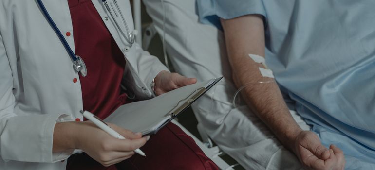Doctor assisting a hospital patient