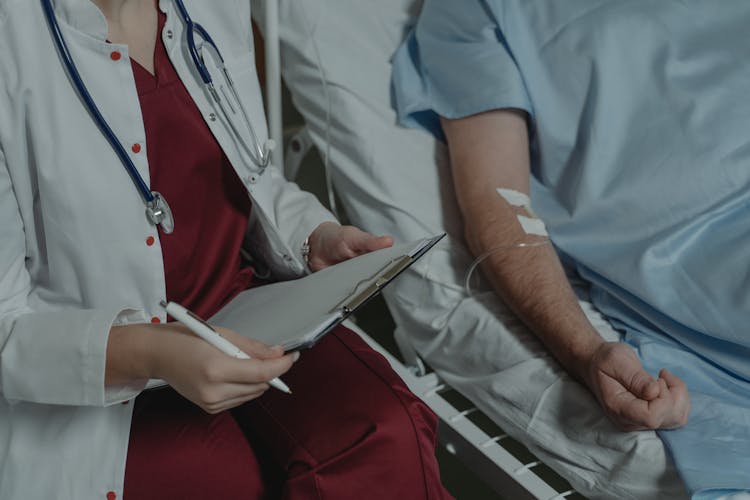 Doctor Beside A Patient