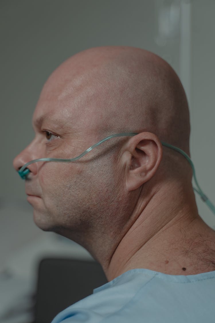 Bald Man Using Nasal Cannula Oxygen