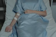 Person in Blue Scrub Suit