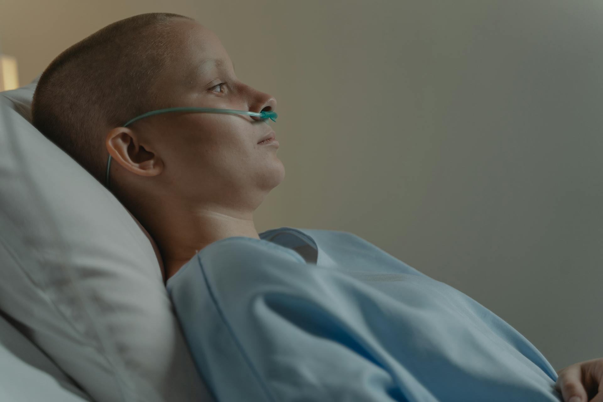 Bald Woman Lying on Hospital Bed