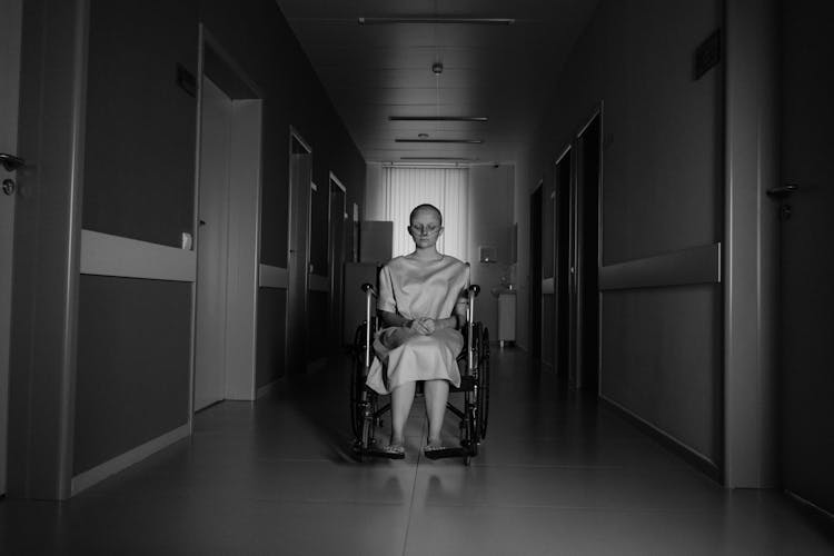 Black And White Photo Of A Patient On A Wheelchair