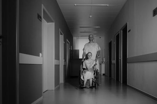 Man and Woman on Hospital Hallway