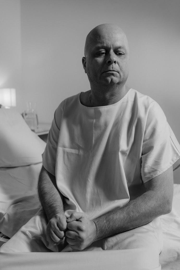 Bald Man Wearing Hospital Gown 