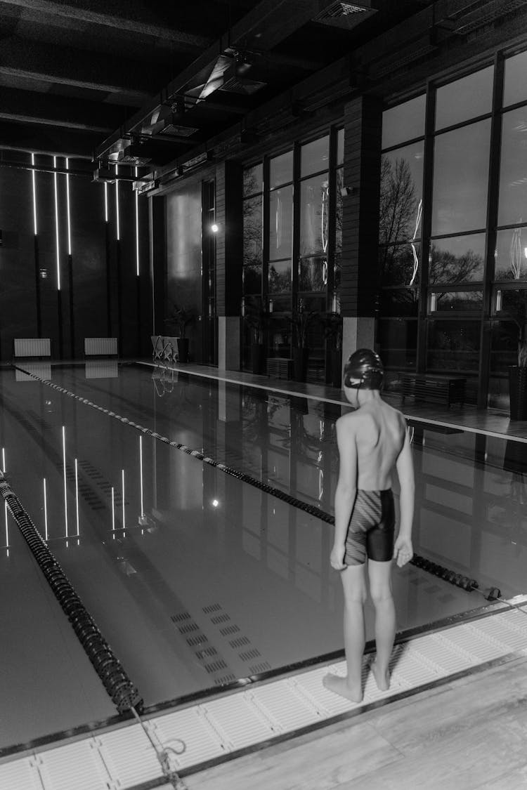 Shirtless Boy Standing On Poolside