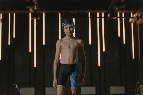 Shirtless Boy Wearing a Swim Cap