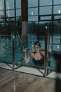 Woman Getting Out of the Swimming Pool