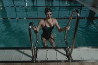 Woman Getting Out of the Swimming Pool