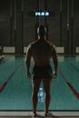 Man in Black Shorts Standing on Swimming Pool