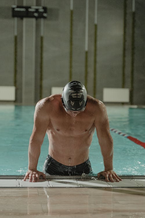 Man in Black Swim Cap in Swimming Pool