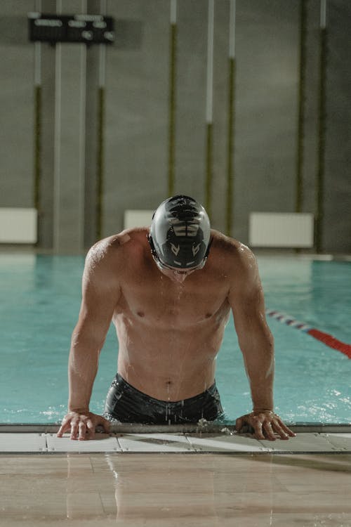 Man in Black Swim Cap in Swimming Pool