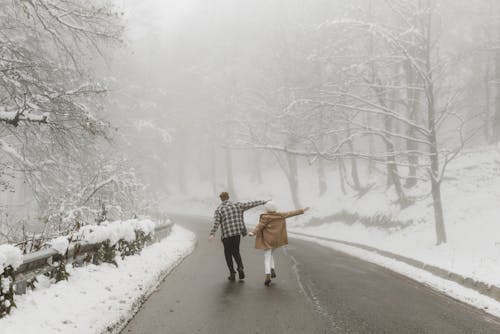 Sweet Moments of Romantic Couple Walking on the Road Together