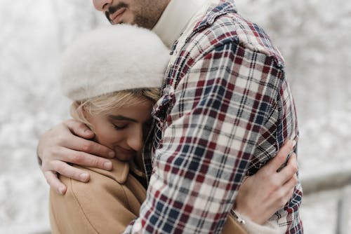Close-up of a Woman Hugging a Man
