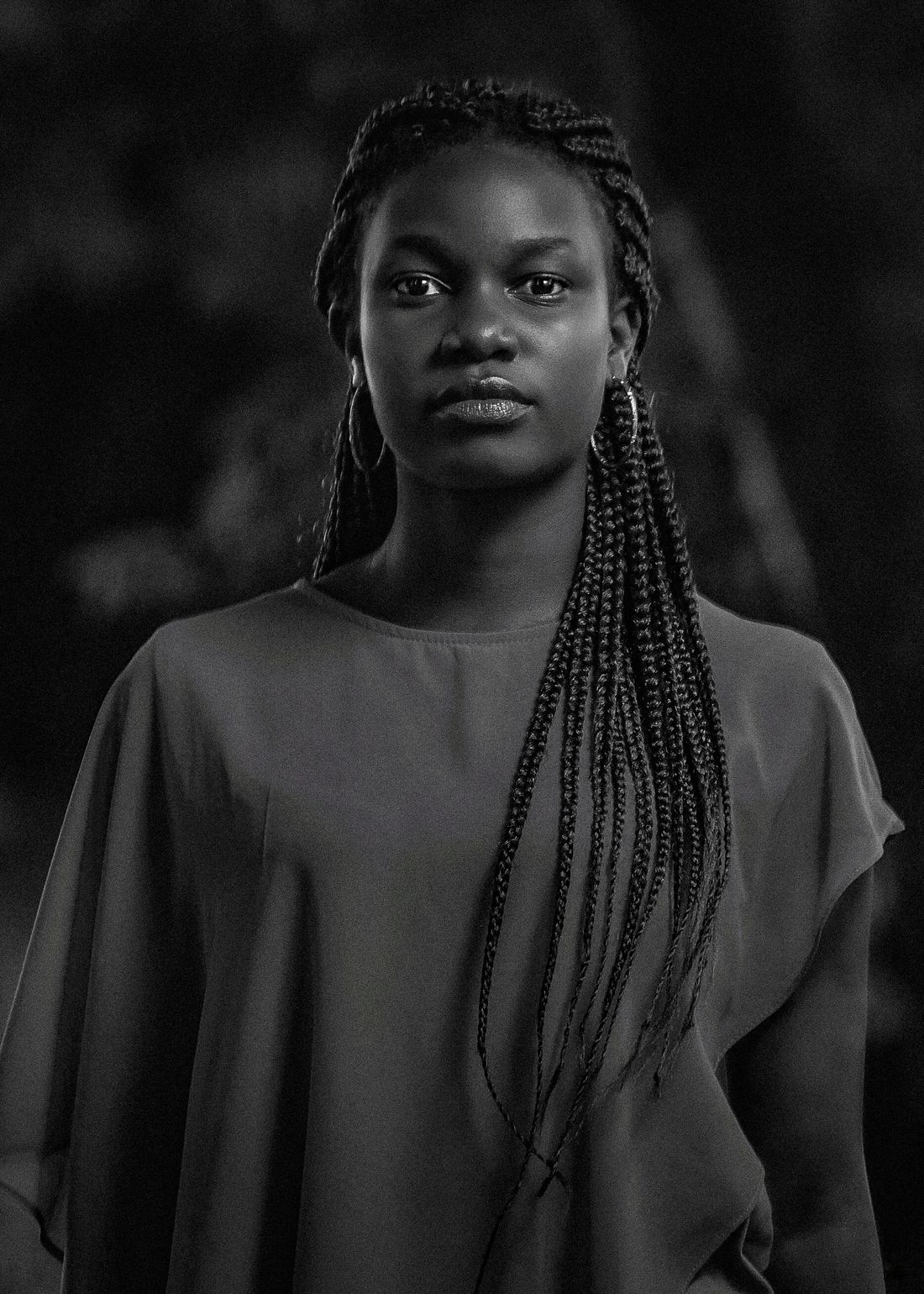 Woman wearing braided protective hairstyle