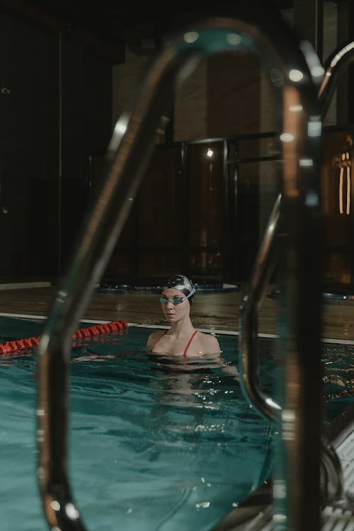 Woman in Swimming Pool Wearing Goggles