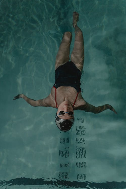 Woman Floating on the Swimming Pool