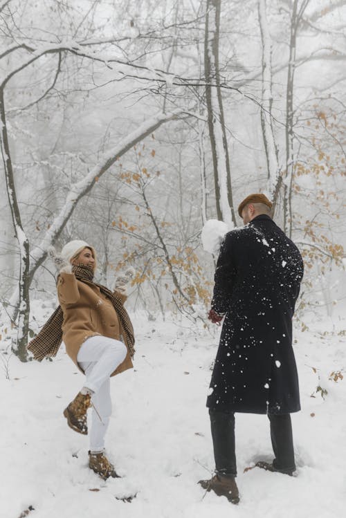 Sweet Moments of Romantic Couple Playing in the Snow