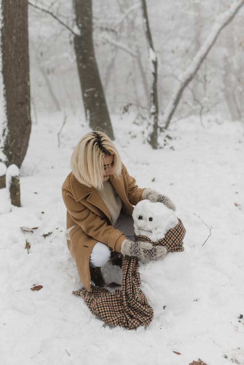 Woman Making a Snowman