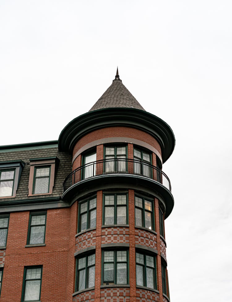 Brown And Black Concrete Building Under White Sky