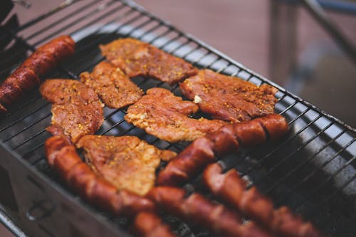 Pork and sausage on the grill