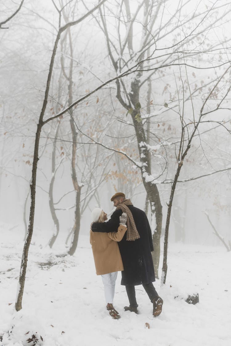 Couple Walking Together On Snow