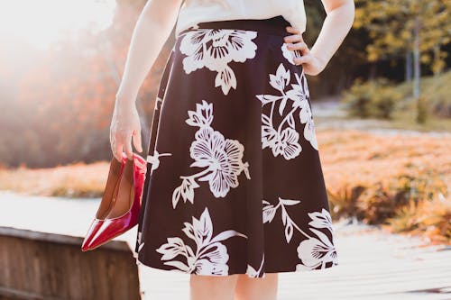 Free Woman Wearing Skirt Holding Her Shoes Stock Photo