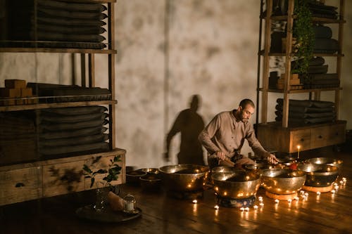 A Man Meditating Using Tibetan Singing Bowls