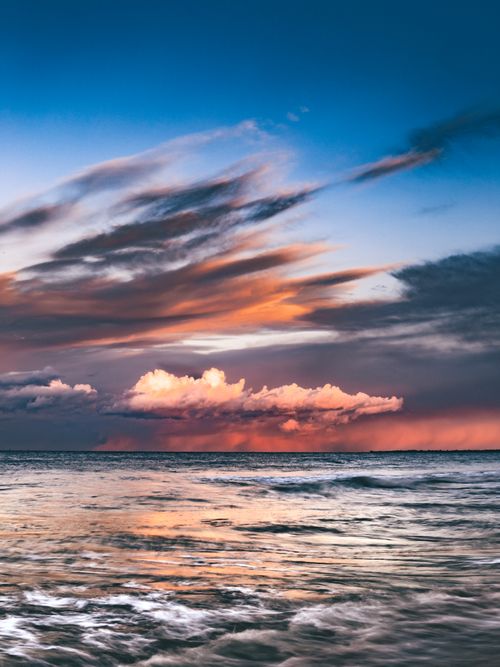 Free Stunning sky reflection at Gdańsk beach during a dramatic sunset, capturing nature's vibrant hues. Stock Photo