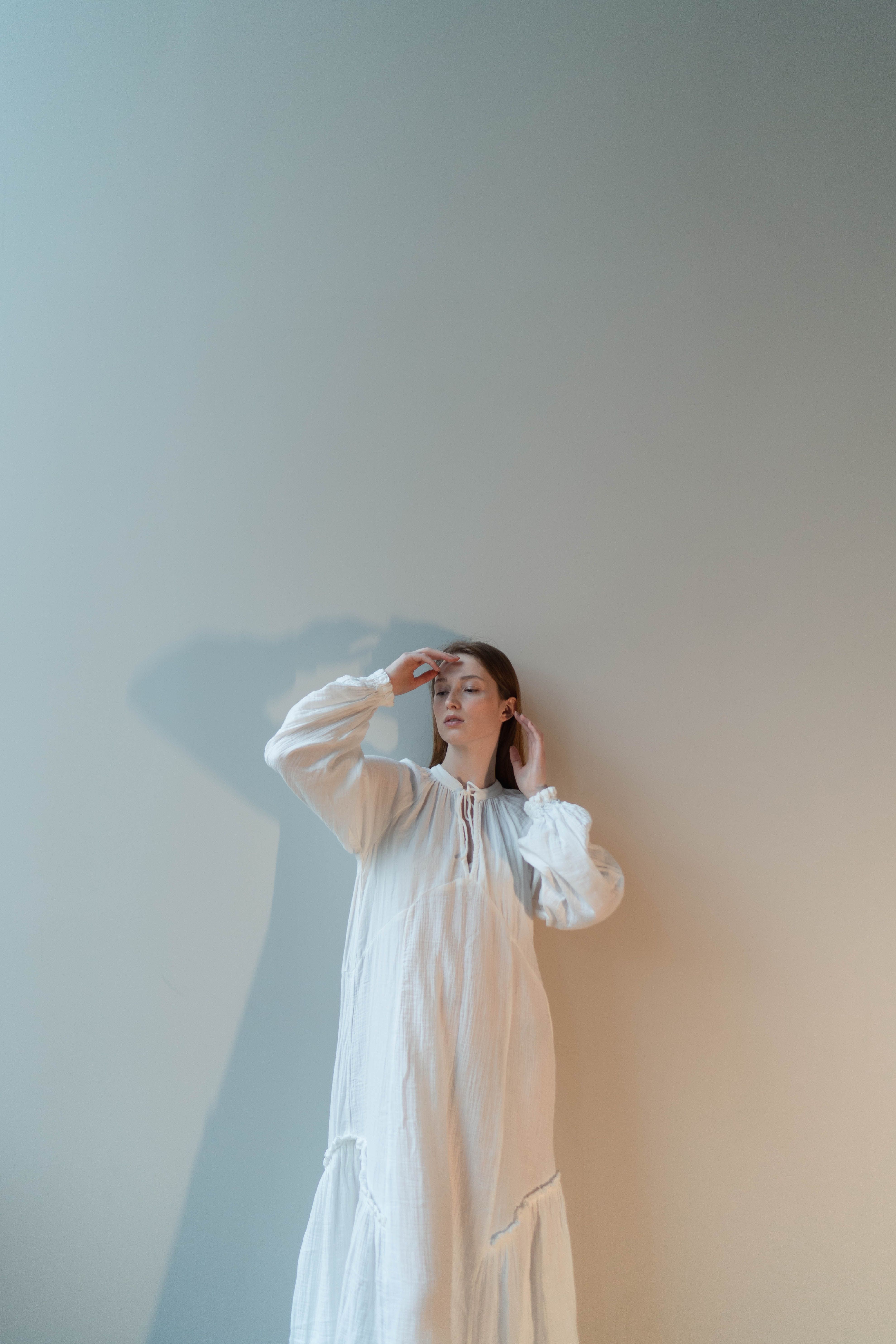 A Woman in White Long Sleeve Dress · Free Stock Photo
