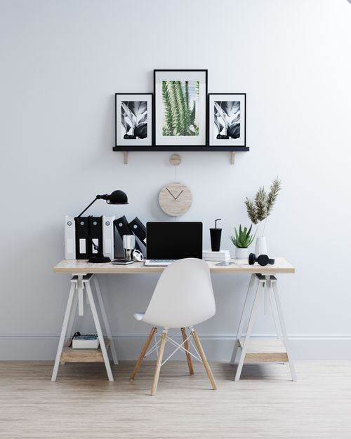 Free A clean and stylish home office with minimalist decor and a laptop on the desk. Stock Photo