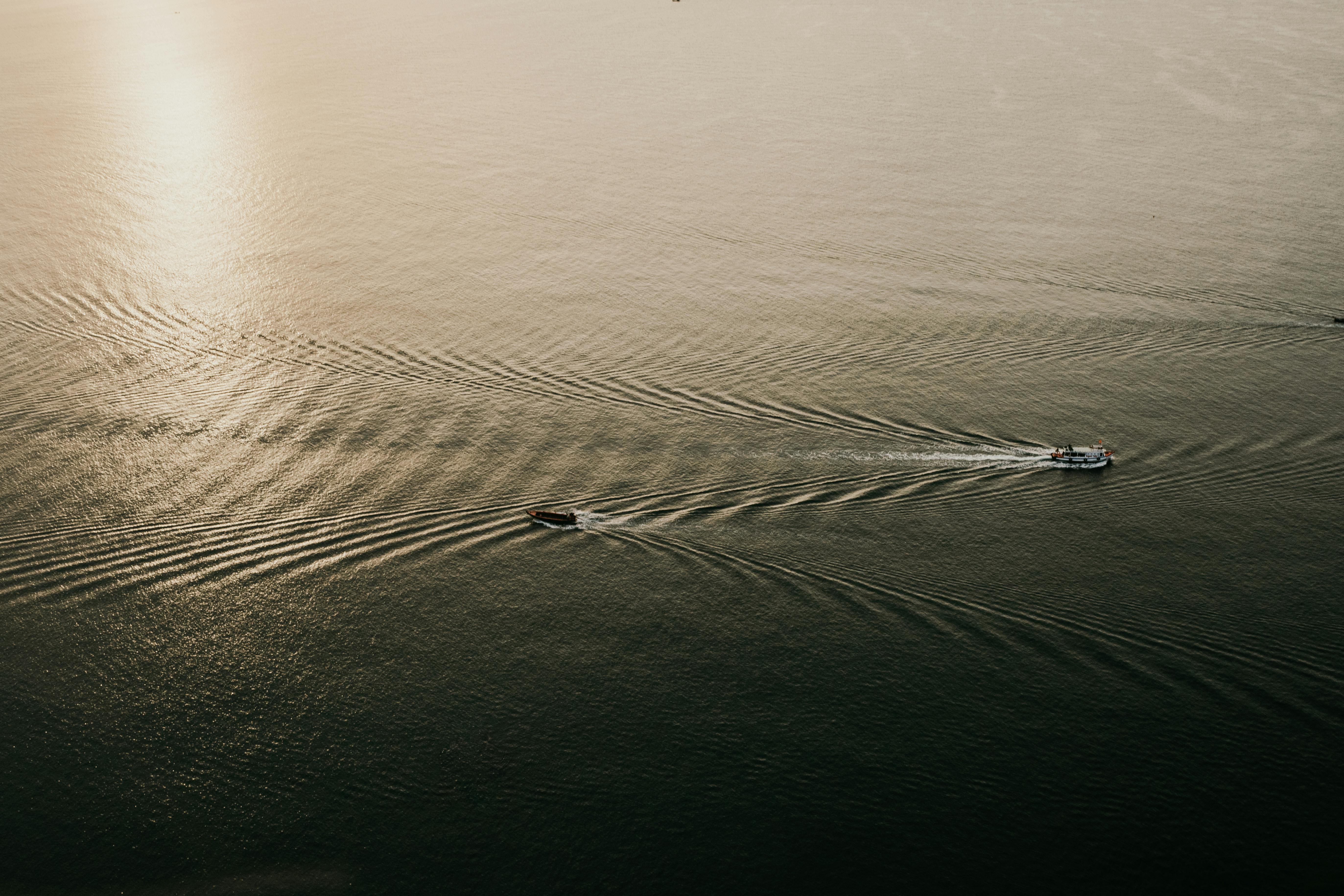 white boat on body of water