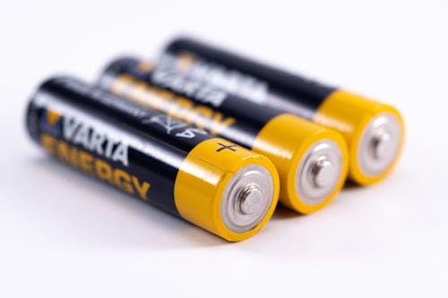 Close-Up Shot of Black and Yellow Batteries