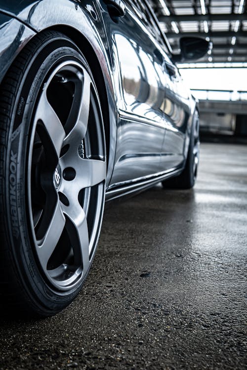 Silver Car on Concrete Pavement