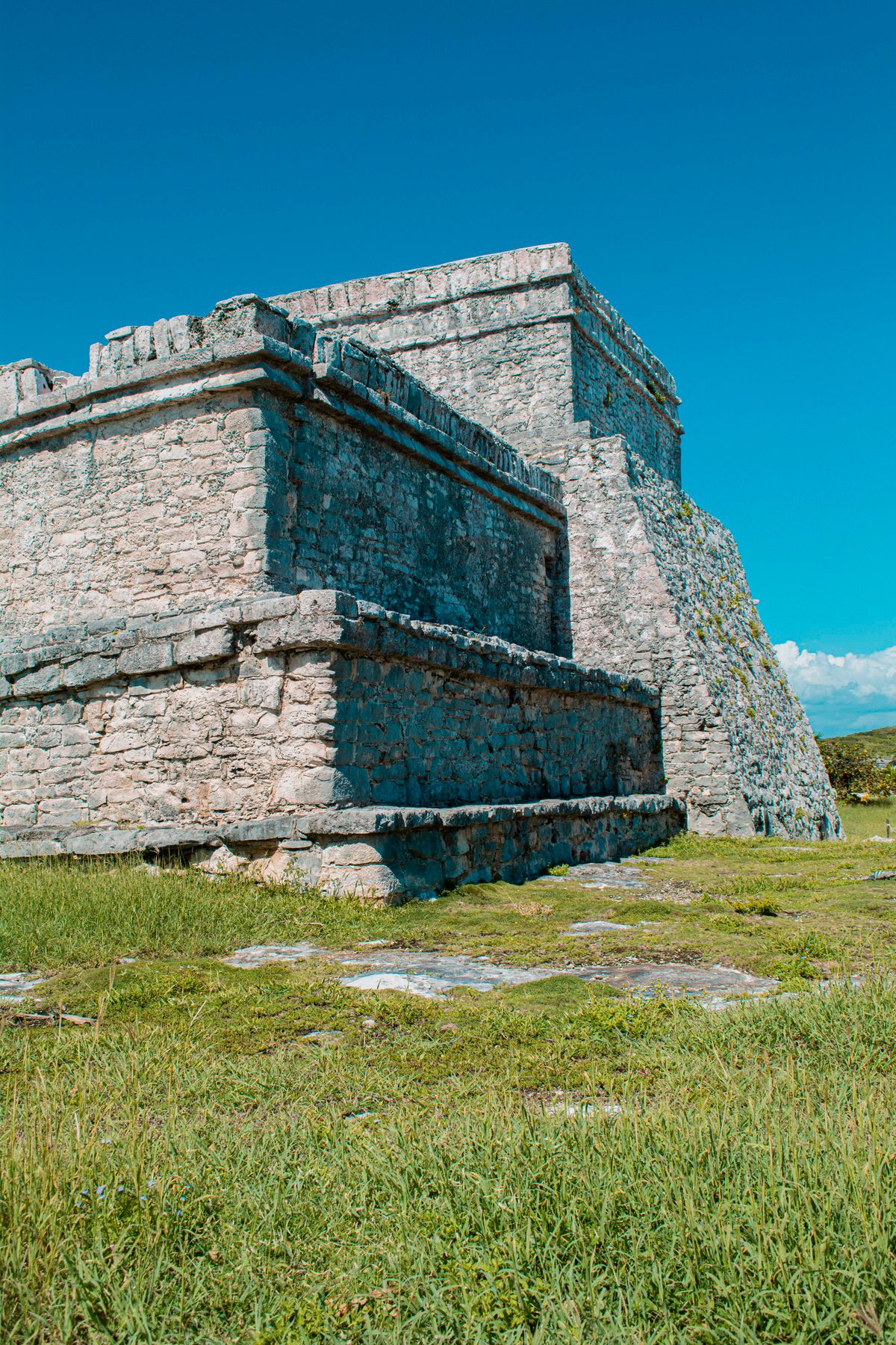 Discover the stunning ancient Mayan ruins of Tulum under a clear blue sky.