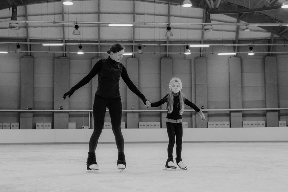beginner taking ice skating lesson beginner taking ice skating lesson