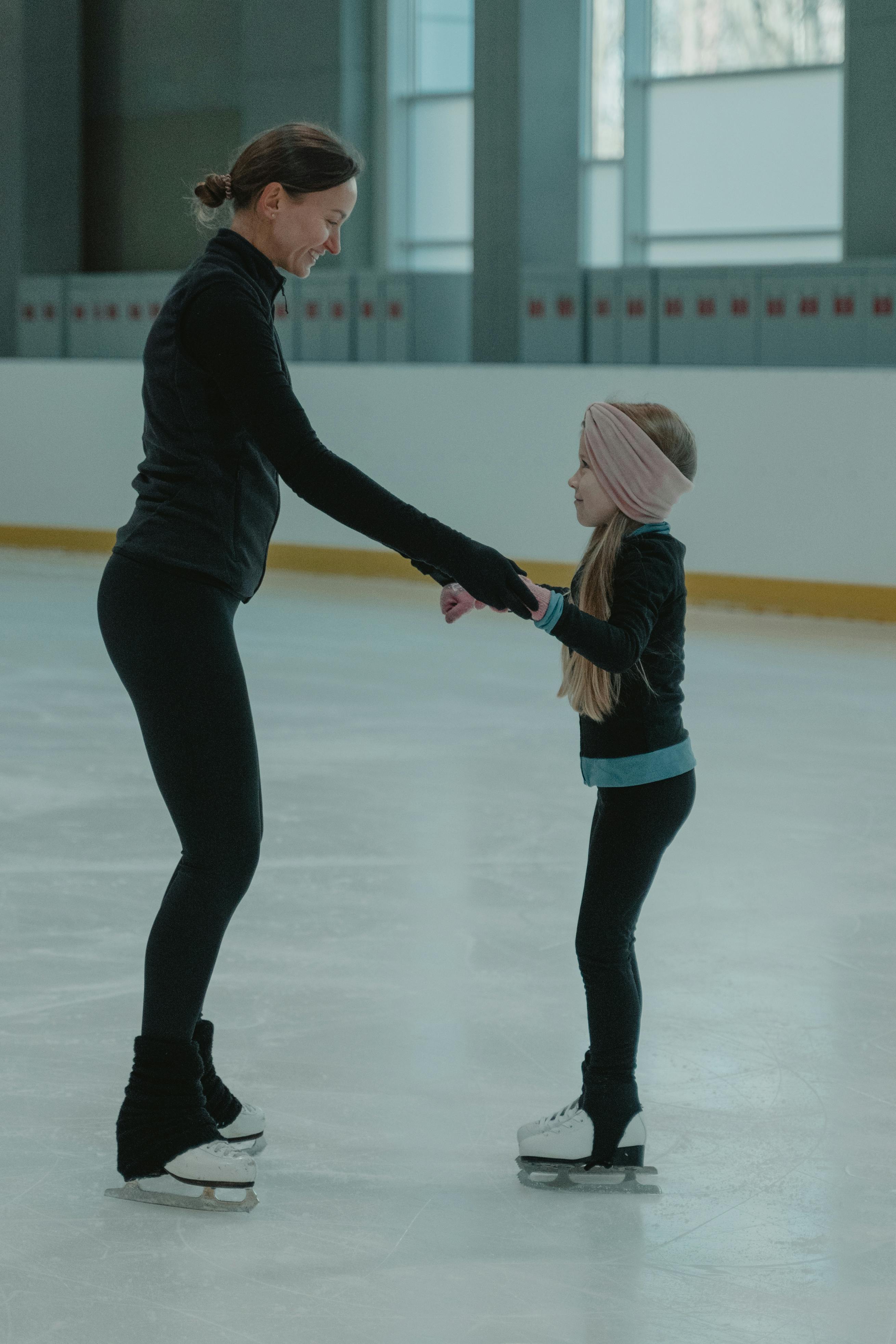 Teacher and a Student in an Ice Skating Arena · Free Stock Photo