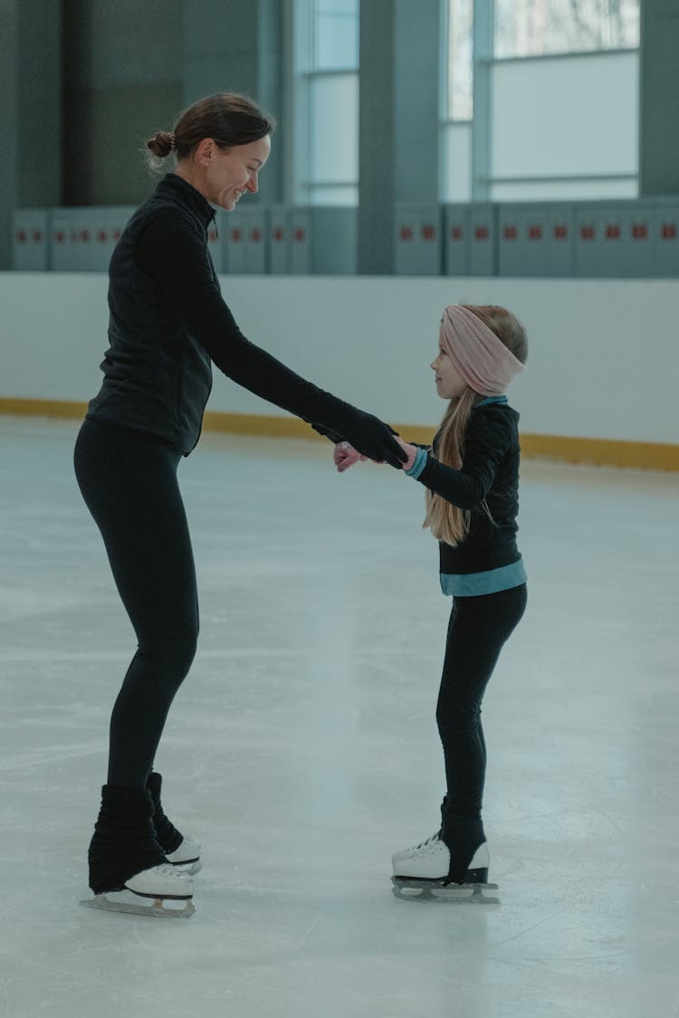 Teacher And A Student In An Ice Skating Arena 