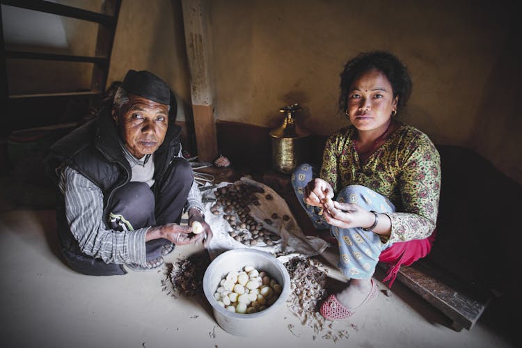 Indian Women Peeling Raw Potatoes In House