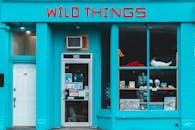 Face of building of local store with blue walls located in city in daylight