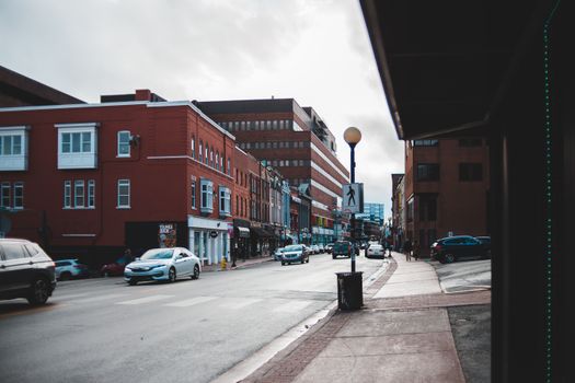 Explore the vibrant urban streets with classic architecture and bustling traffic.