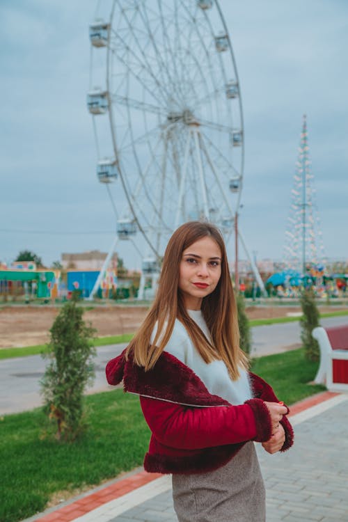 Attractive woman standing in amusement park