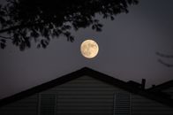 White and Black House Under Full Moon