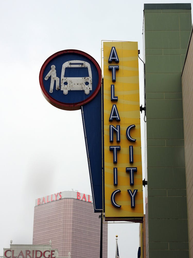 Vertical Shot Of City Neons And Signs