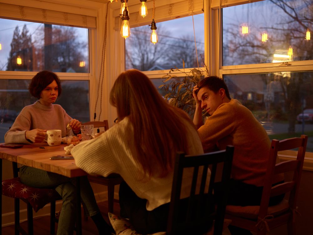 Three People Sitting at the Table · Free Stock Photo