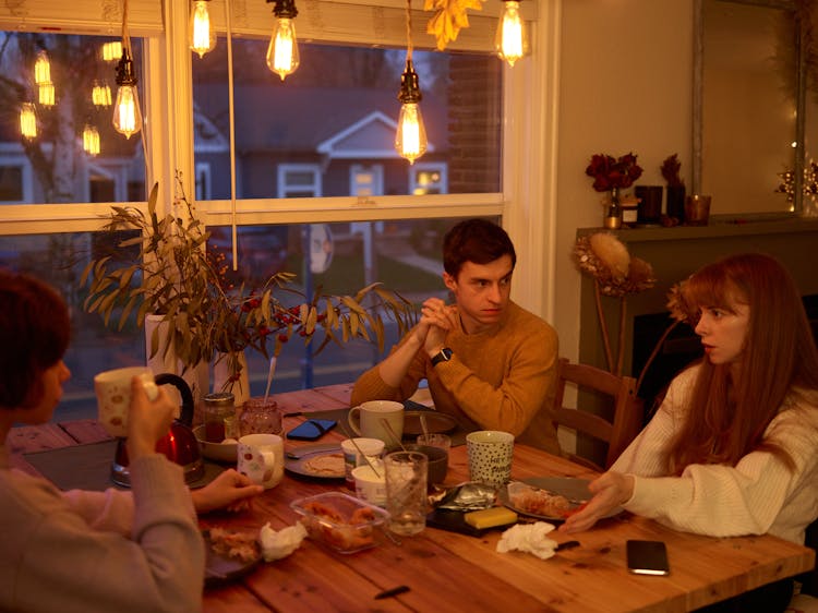 Family Talking Over Dinner