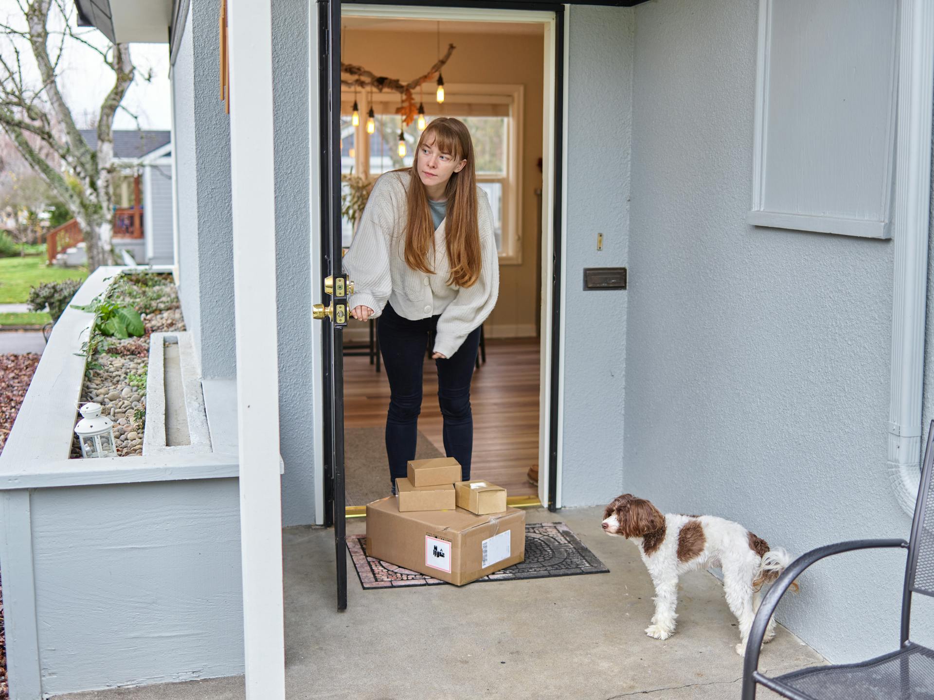 Woman Receiving Boxes at Door