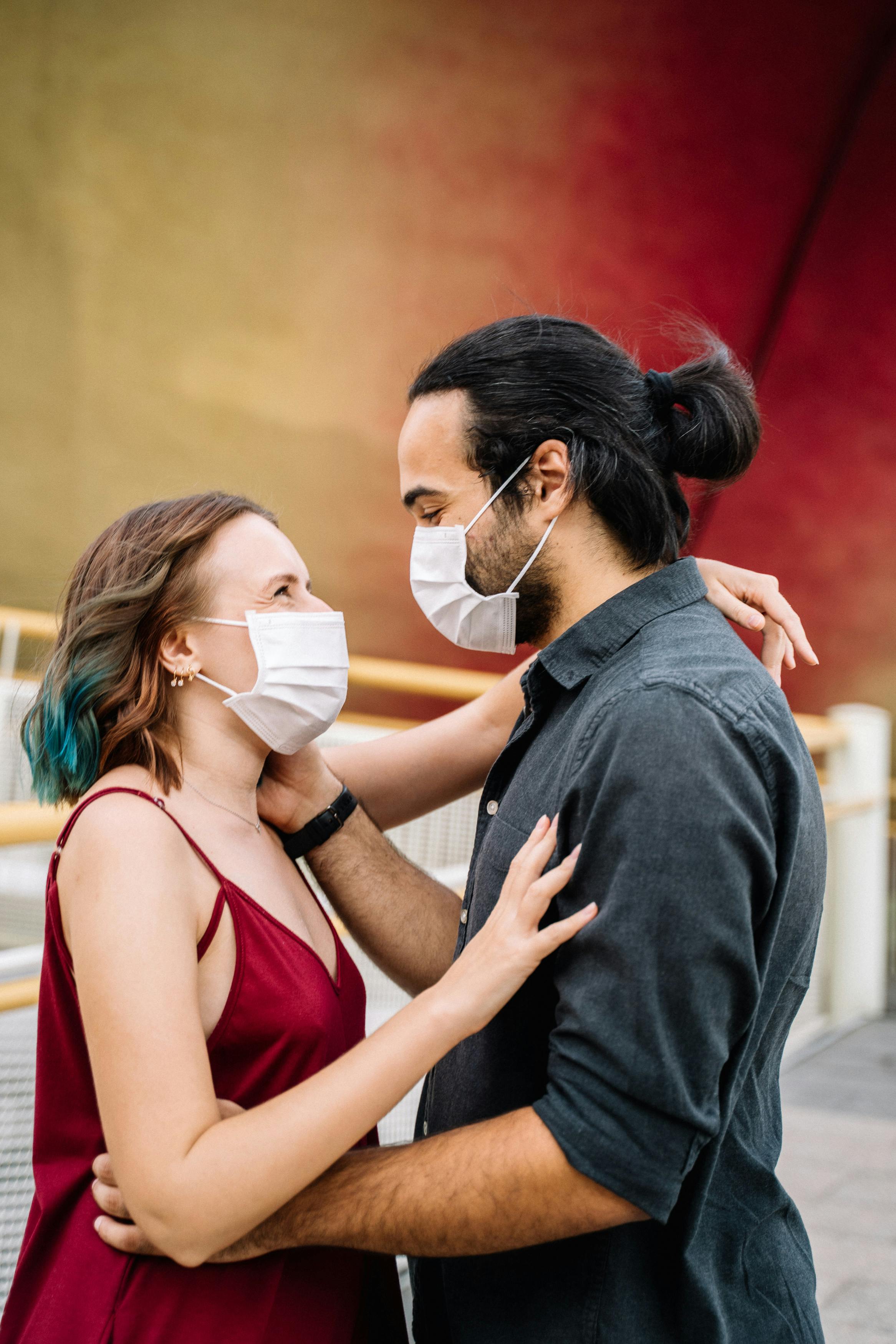 File:Laughing woman wearing tank top and face mask in Madison